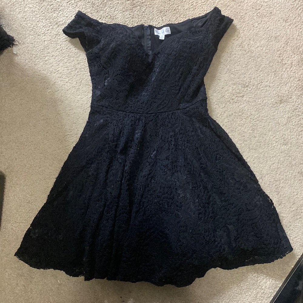 Black off the shoulder lace party dress.